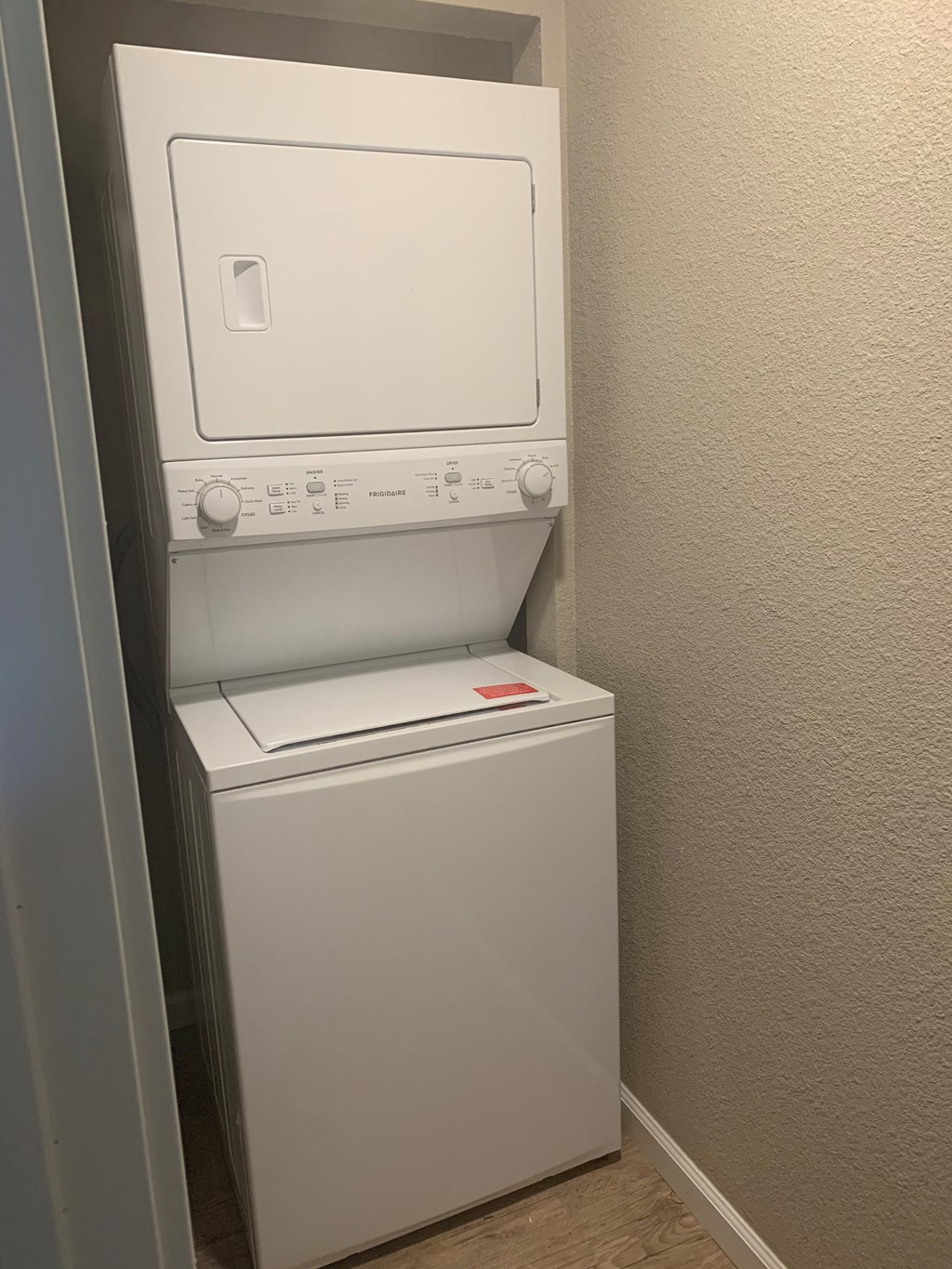 View of stacked washer and dryer - included in select units