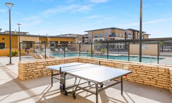 Ping pong table near the swimming pool at Solace at Ballpark Village, Goodyear, AZ, 85338