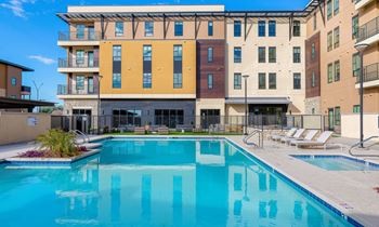 Relaxing Swimming Pool With Sundeck at Solace at Ballpark Village, Goodyear, AZ
