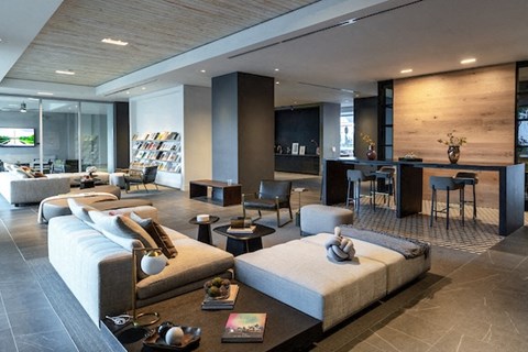 A modern living room with a large couch and a coffee table.