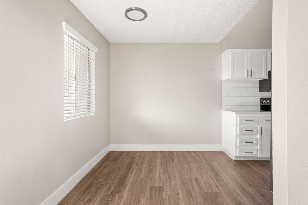 a kitchen and dining area in a 555 waverly unit