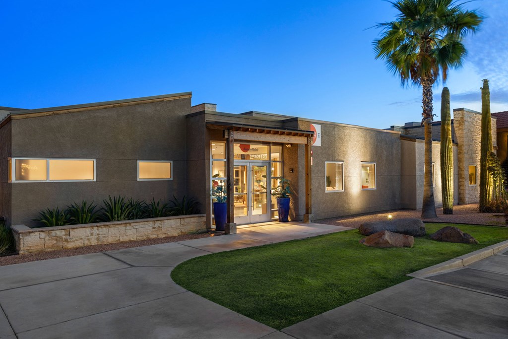 a building with a palm tree in front of it