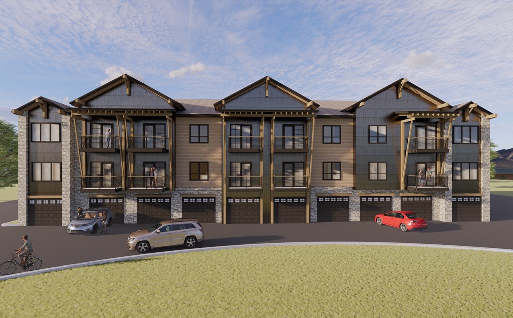 a rendering of an apartment building with cars parked in front of it