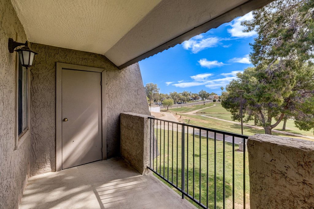 the view from the balcony of a building with a door to a balcony with a