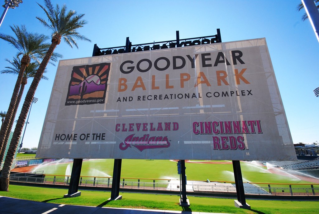 a sign for goodyear ballpark and recreation complex in front of a baseball field