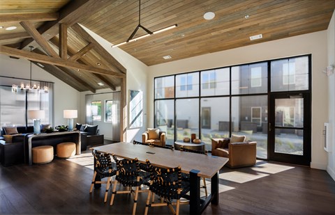 A modern dining room with a wooden table and chairs at The Crossings  at Windsong, Prescott Valley, 86314