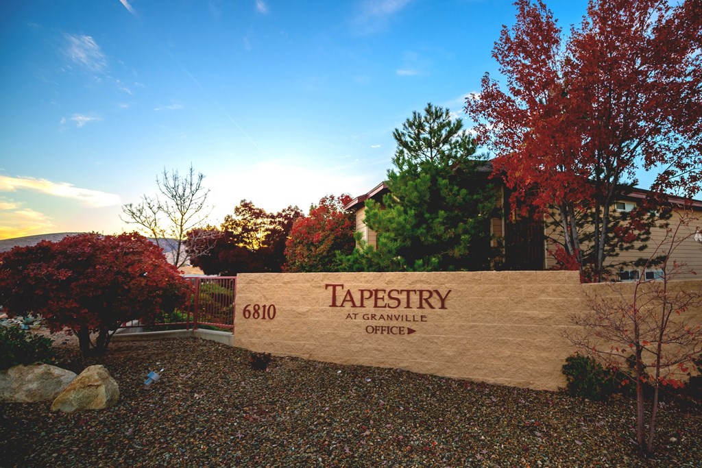 a sign at the entrance of tapestry