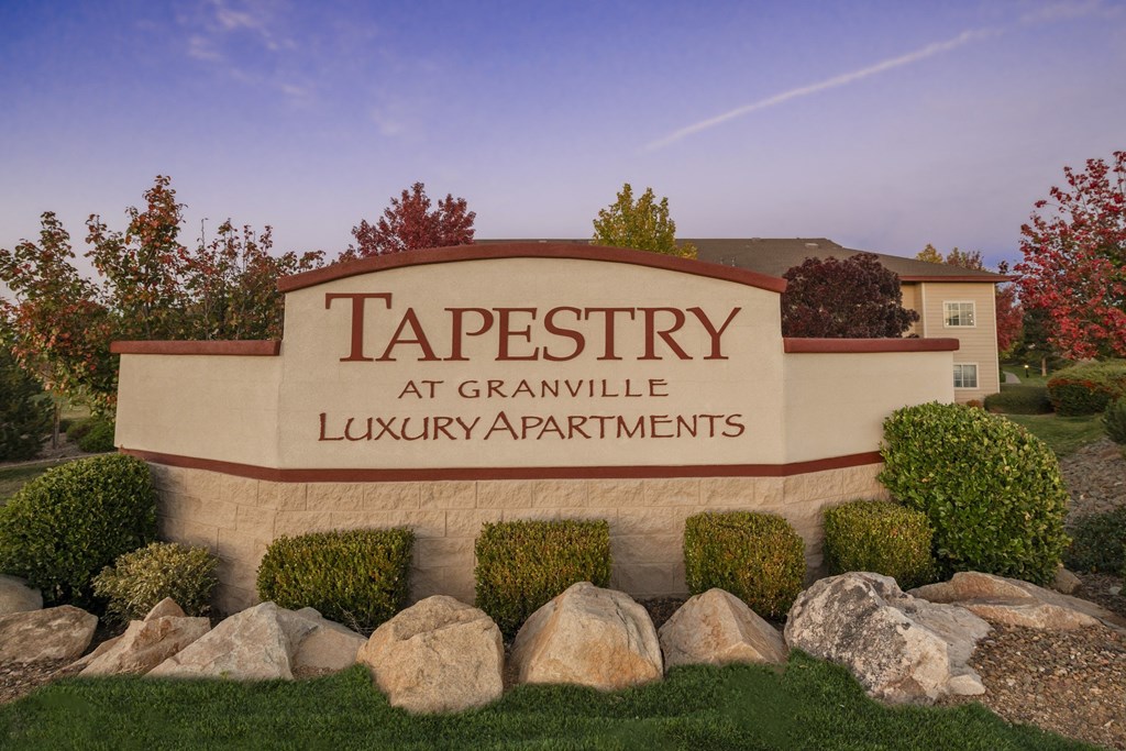 a sign for tapestry luxury apartments