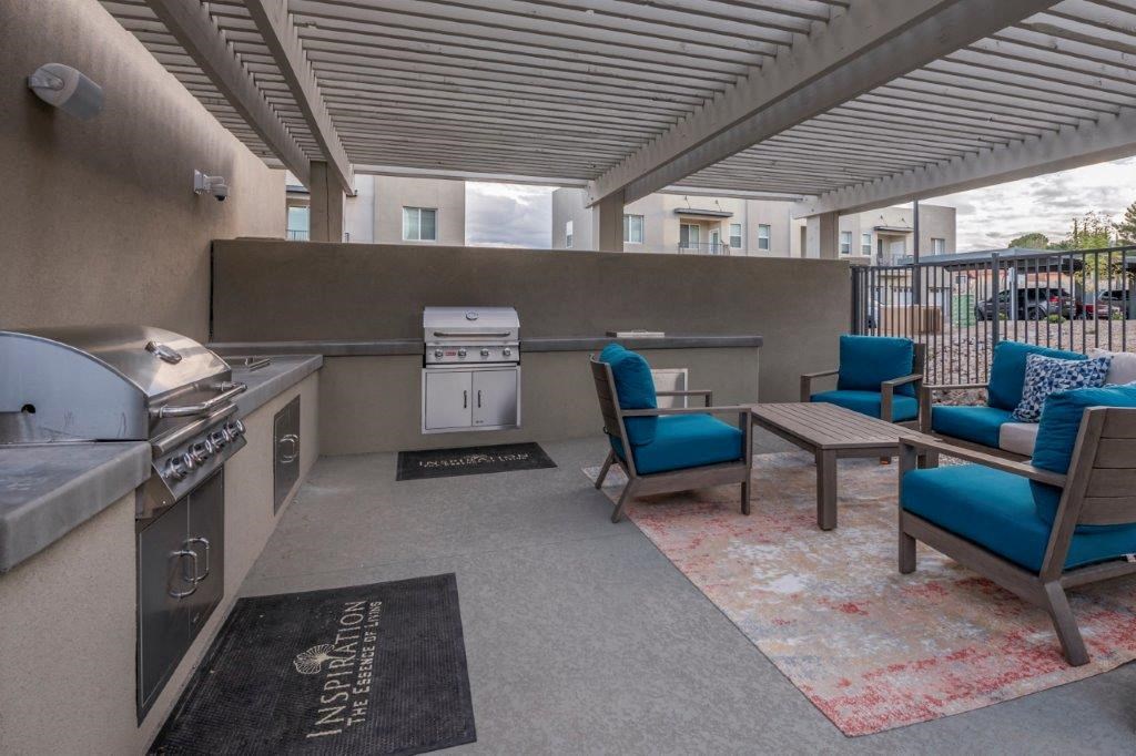 a spiral staircase in a building with blue chairs at Inspiration Apartments, Cottonwood, Arizona