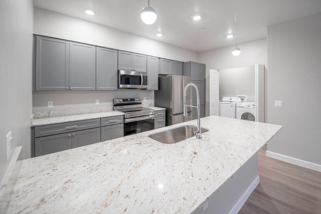 a view of a kitchen with white tiled flooring at Inspiration Apartments, Cottonwood, AZ, 86326