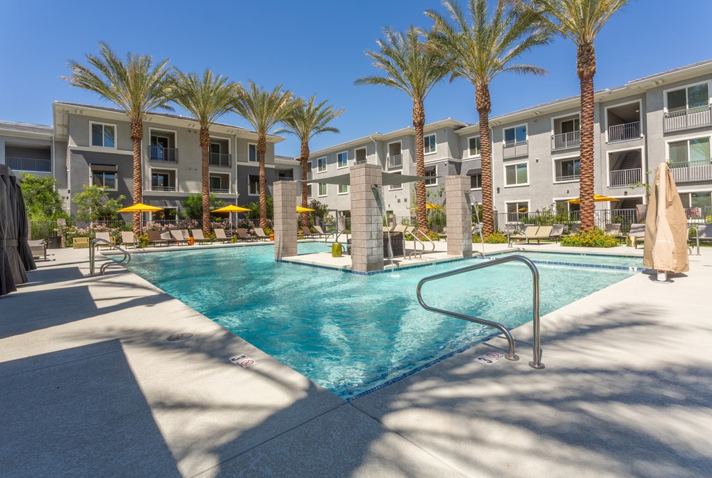 1-Bedroom Luxury Apartments In North Phoenix, AZ - The Amelia - Stunning Pool And Spa with Poolside Cabanas And Seating Areas With Fire Pits.