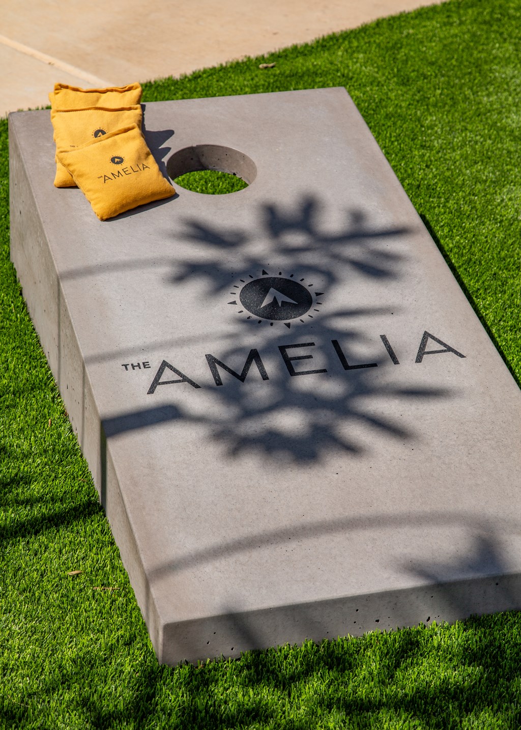 A grey slab with the word "AMELIA" and a snowflake design on it.
