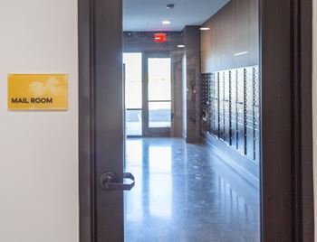 A door with a sign that says "mail room" on it.