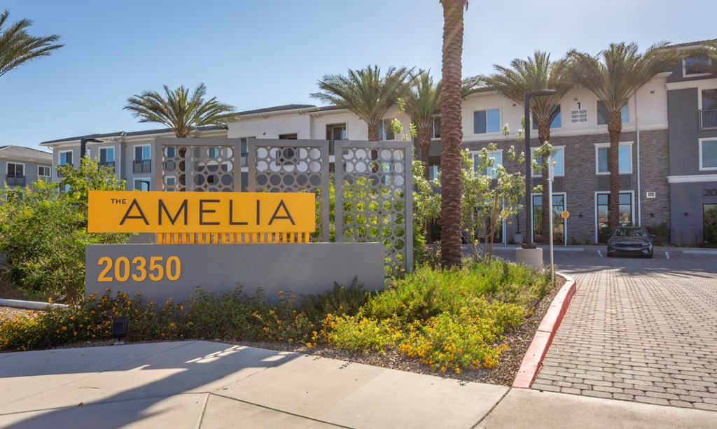 A sign for Amelia 20350 is in front of a building.