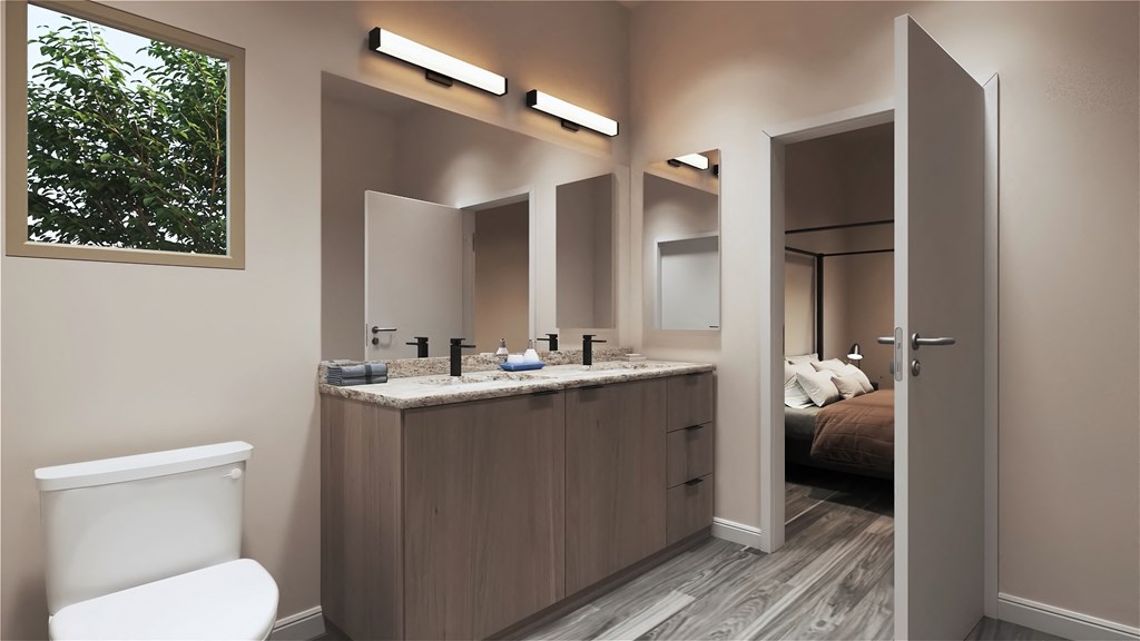a bathroom with a toilet and a sink at Marketside Villas at Verrado, Buckeye, AZ 85396