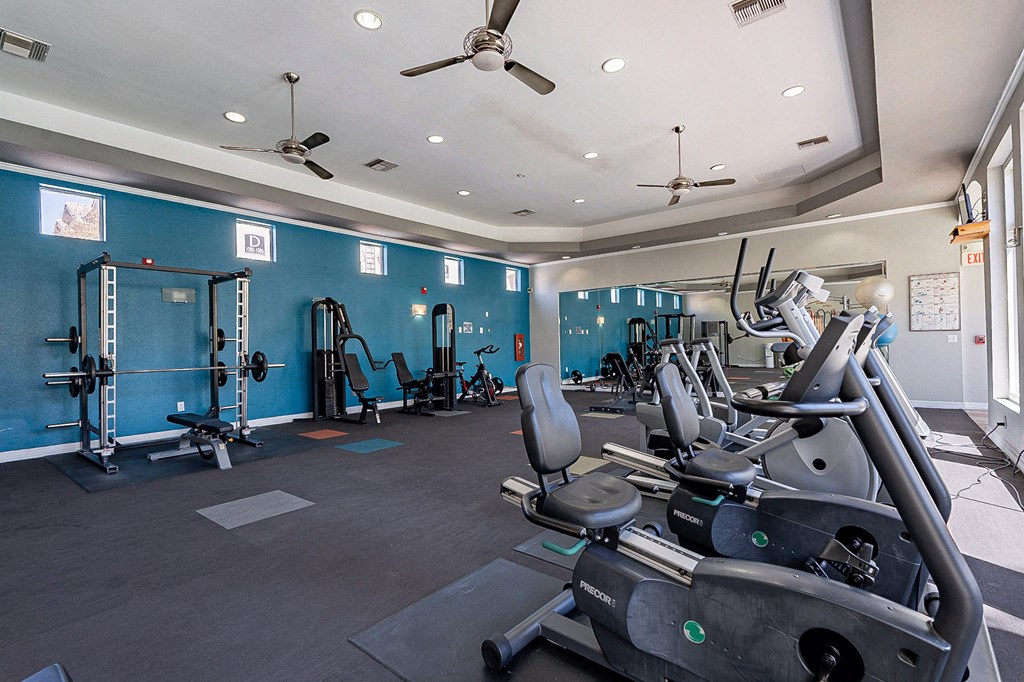 A gym with a row of treadmills and exercise equipment.at Palazzo Townhomes, Phoenix Arizona  