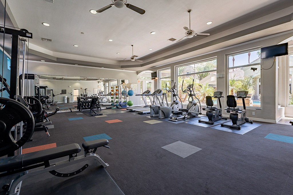 A spacious gym with a variety of exercise equipment.at Palazzo Townhomes, Arizona  