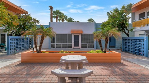 A building with a sign that reads at The Phoenix Apartments on 6th Avenue, Phoenix
