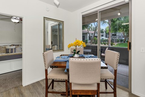 Dining area with patio access and natural light at Ventura Vista Apartments, Phoenix, AZ 85024