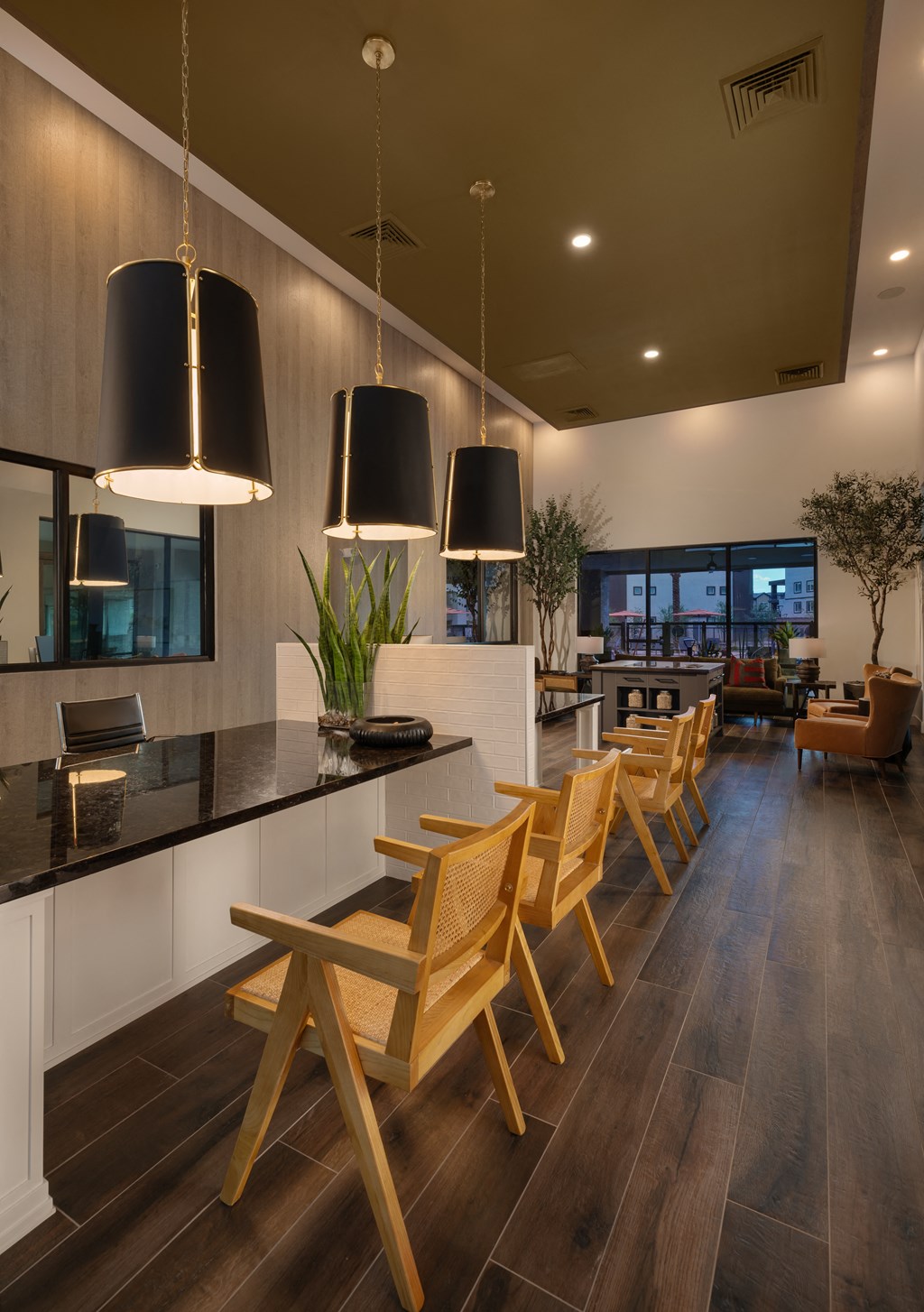 a kitchen and dining room with wooden chairs and a tableat Weylyn Luxury Apartments, Arizona