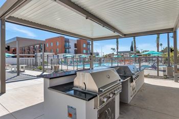 our apartments showcase an outdoor kitchen at Melody on Main, Mesa