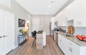 a kitchen and dining area at Melody on Main, Mesa, Arizona