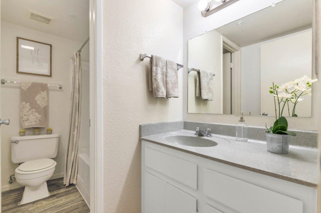 a white bathroom with a sink and a toilet  at Glen Brae, Glendale