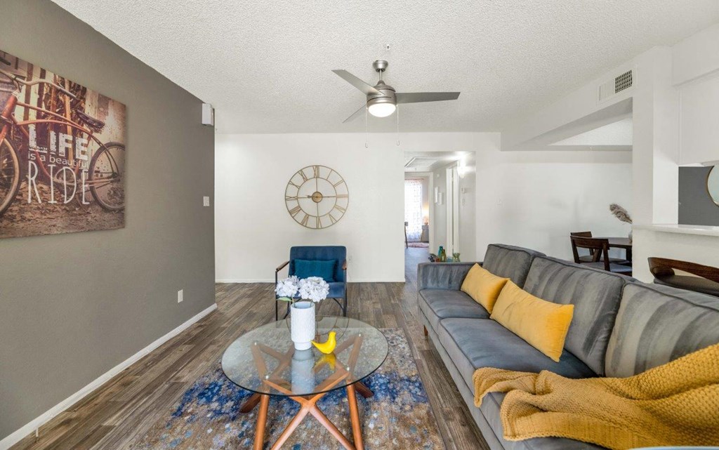 a living room with a couch and a table  at Glen Brae, Glendale, AZ