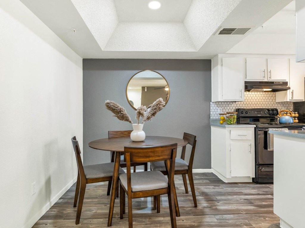 a kitchen and dining room with a table and chairs  at Glen Brae, Glendale, Arizona