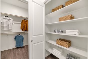 a walk in closet in a 555 waverly unit