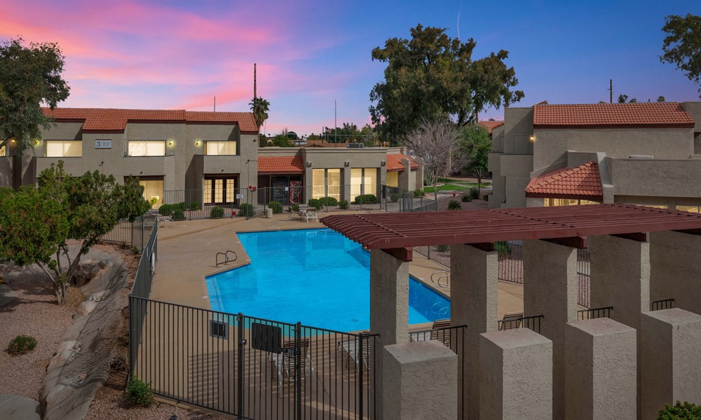 an aerial view of a swimming pool at dusk
