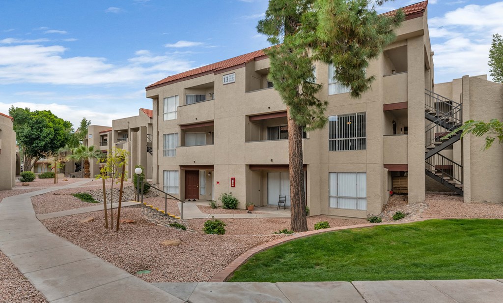 our apartments have a spacious courtyard with grass and trees