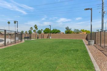 a grassy area with a fence and a bench at Thunderbird, Arizona, 85306