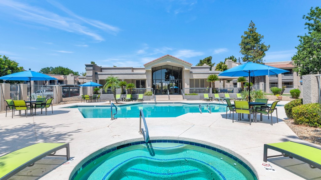 A swimming pool with a slide in the middle of it.
