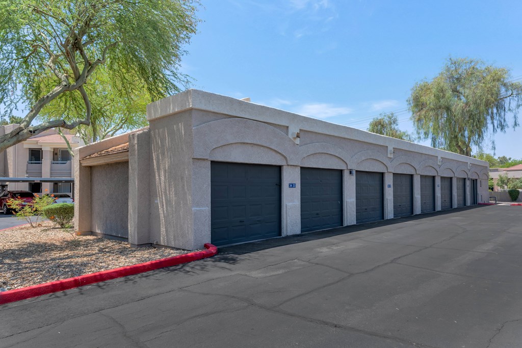 A long building with a red line in front of it.