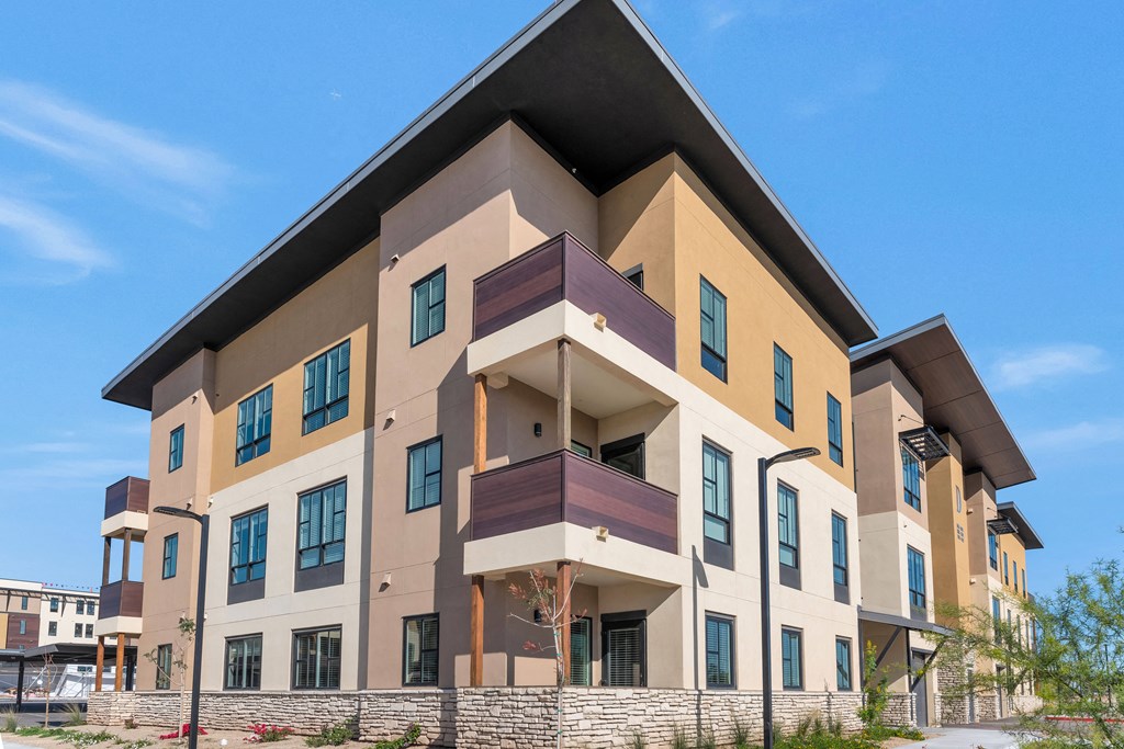 a new apartment building with a triangular roof on top of it