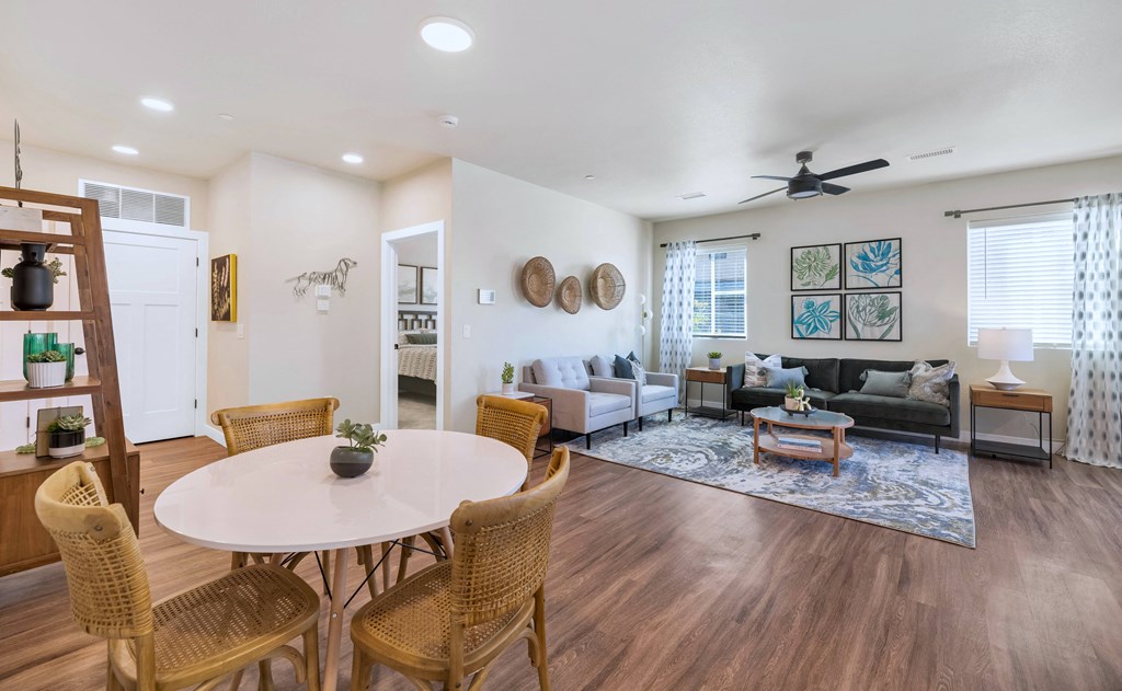 a living room with a dining table and a couch