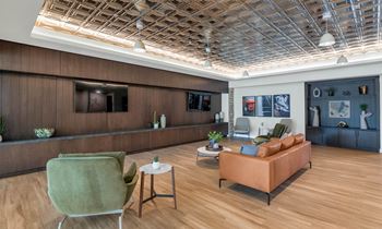 Community living room with TV at Solace at Ballpark Village, Goodyear, AZ