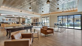 Community area with a glass ceiling and a dining area at Solace at Ballpark Village, Arizona  , 85338
