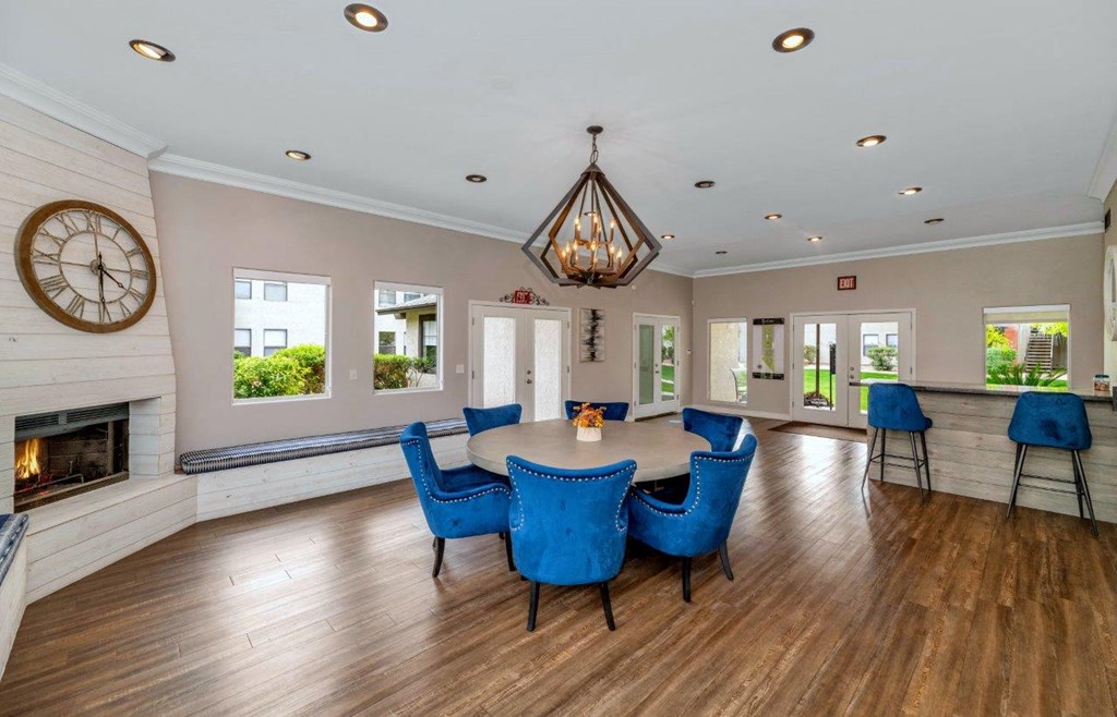 a dining room with a table and chairs and a fireplace