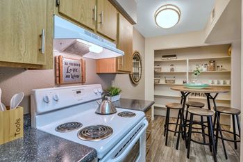 A kitchen with a stove at Reflections at Red Mountain Apartments, Mesa, AZ, 85213