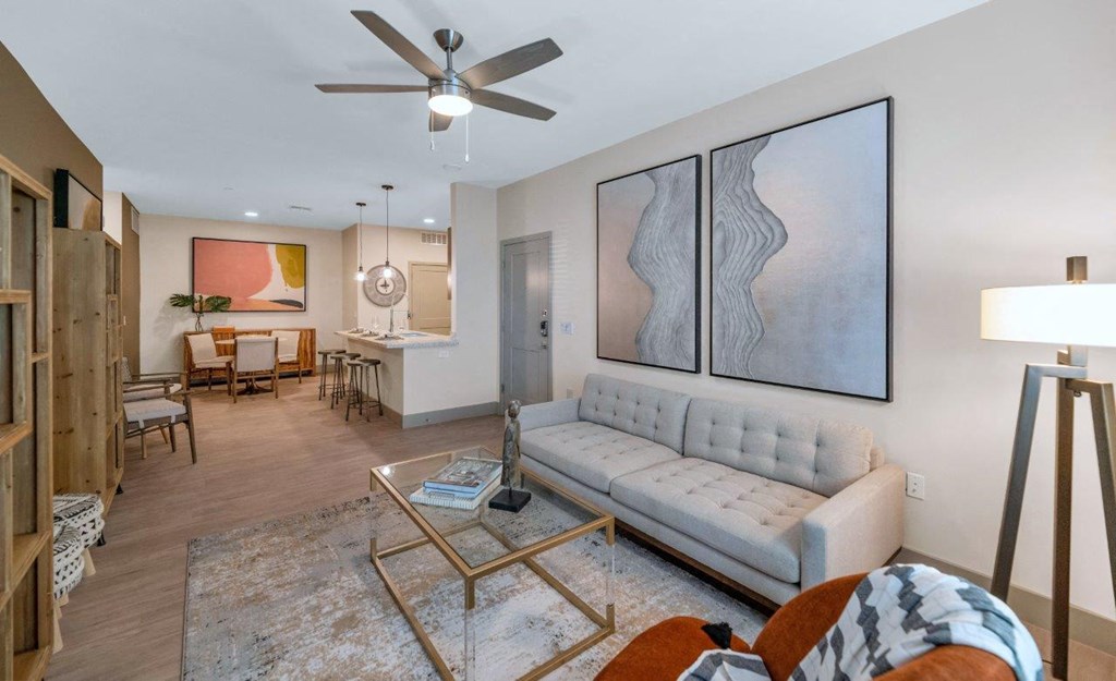 Living room with sofa and wall frames at Zaterra Luxury Apartments, Arizona
