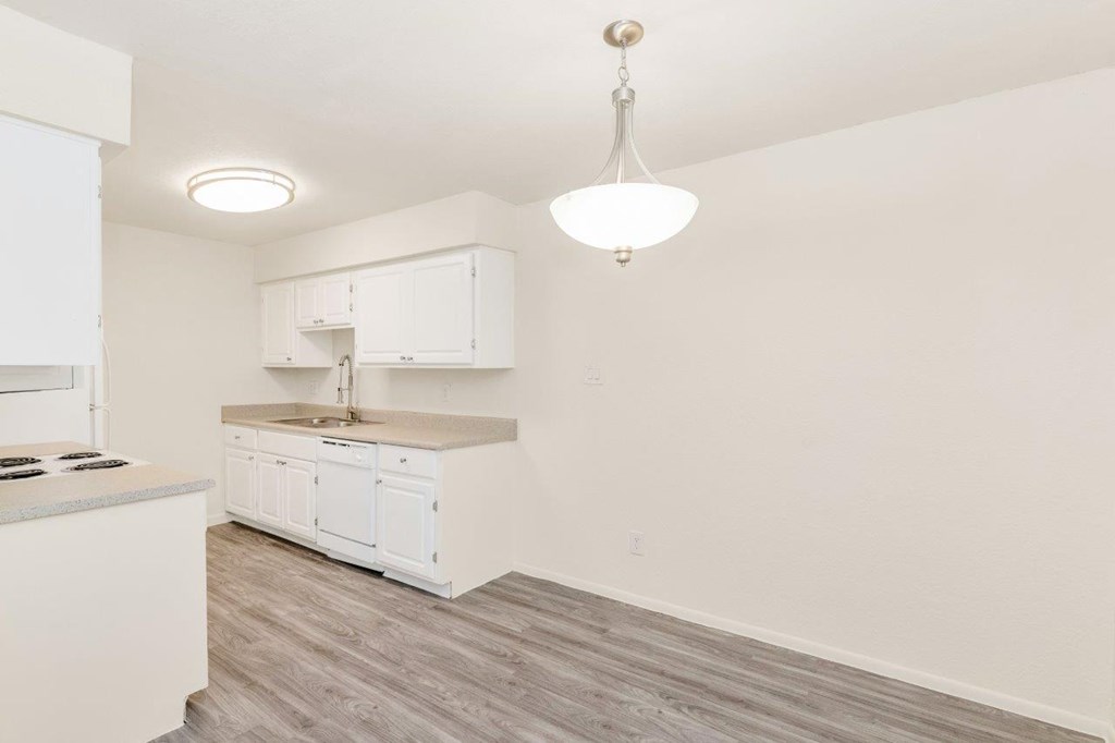 a kitchen and dining area in a 555 waverly unit