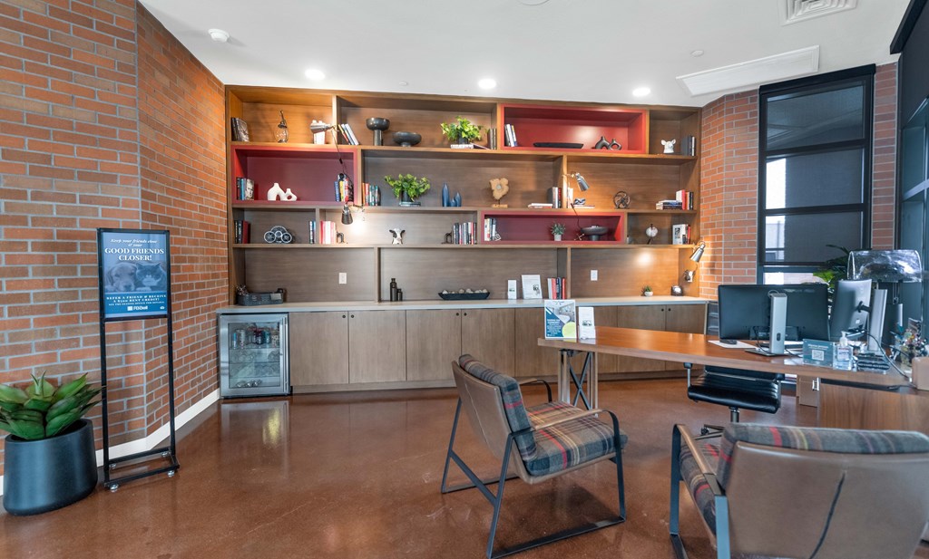 A room with a brick wall and a wooden floor at Marketside Villas at Verrado, Buckeye, AZ