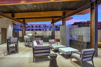 Outdoor Grill With Intimate Seating Area Outdoor Grill With Intimate Seating Area at The Premiere at Eastmark Apartments, Mesa, 85212 - Photo Gallery 2