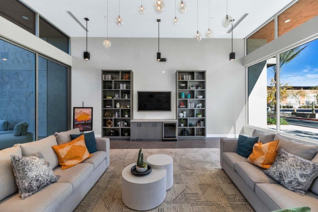 a living room with couches and a tv