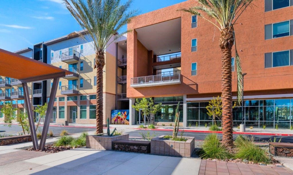 a building with palm trees in front of it
