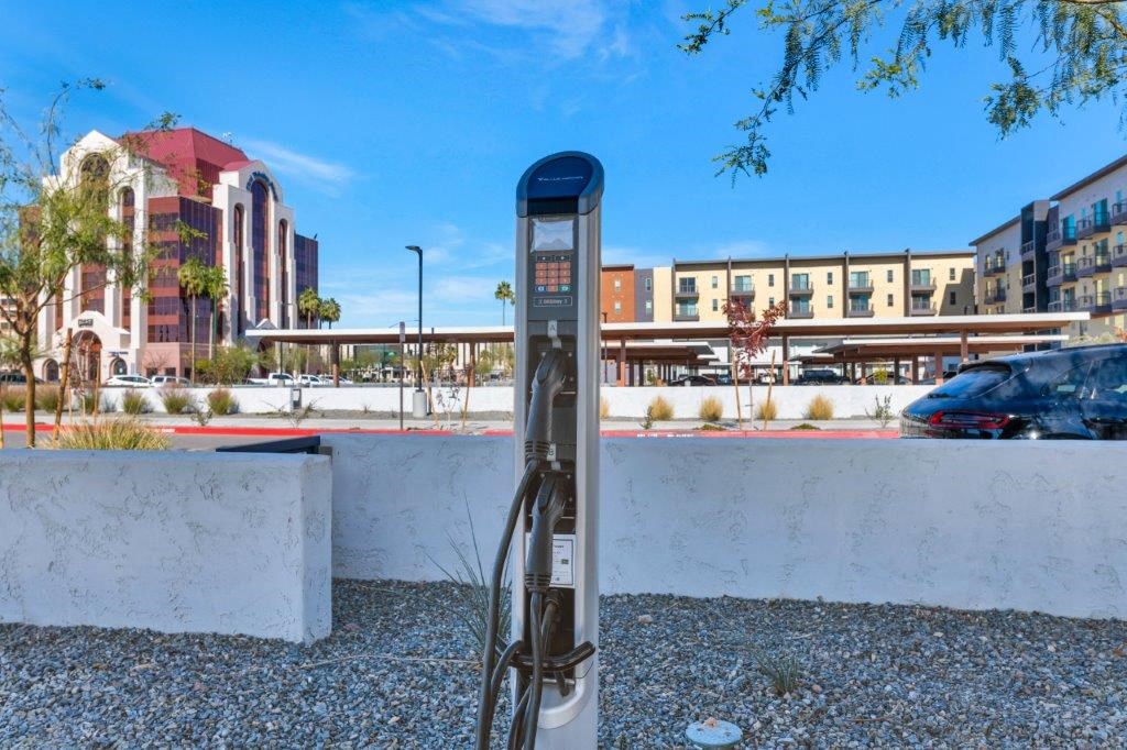 a parking meter in front of a parking lot