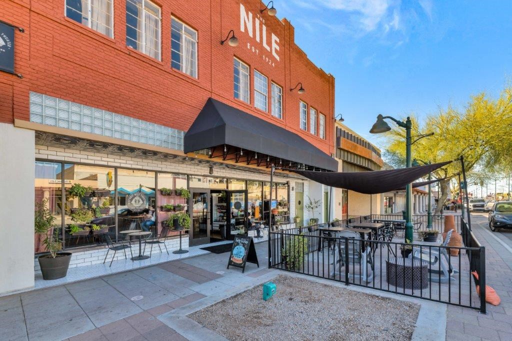 a restaurant with a hammock outside of a building