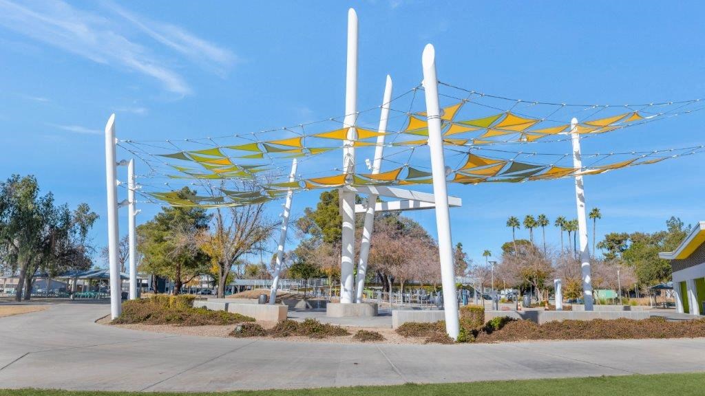 a park with yellow and white structures